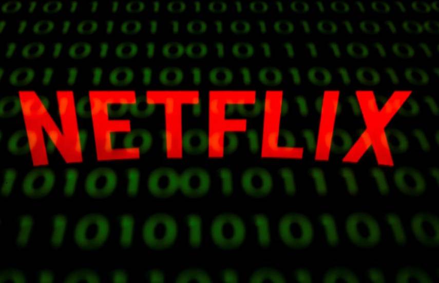 (FILES) This illustration picture shows the US Online Streaming giant Netflix logo displayed on a tablet in Paris on February 18, 2019. - French and Dutch authorities raided streaming giant Netflix's offices in Paris and Amsterdam on November 5, 2024 as part of a tax fraud probe, a judicial source told AFP. (Photo by Lionel BONAVENTURE / AFP)