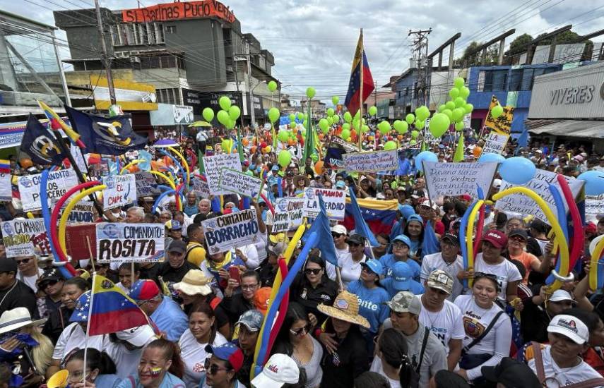 Supporters of Venezuelan presidential candidate Edmundo Gonzalez and opposition leader Maria Corina Machado attend a campaign rally in Barinas, Venezuela, on July 6, 2024. (Photo by Juan Barreto / AFP)